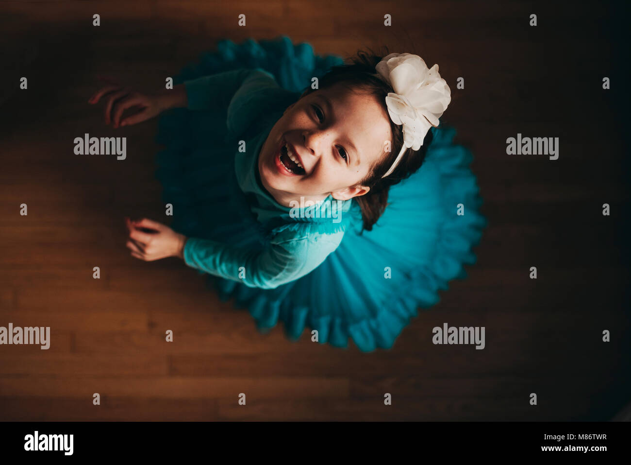 Overhead view of a happy girl spinning around Stock Photo