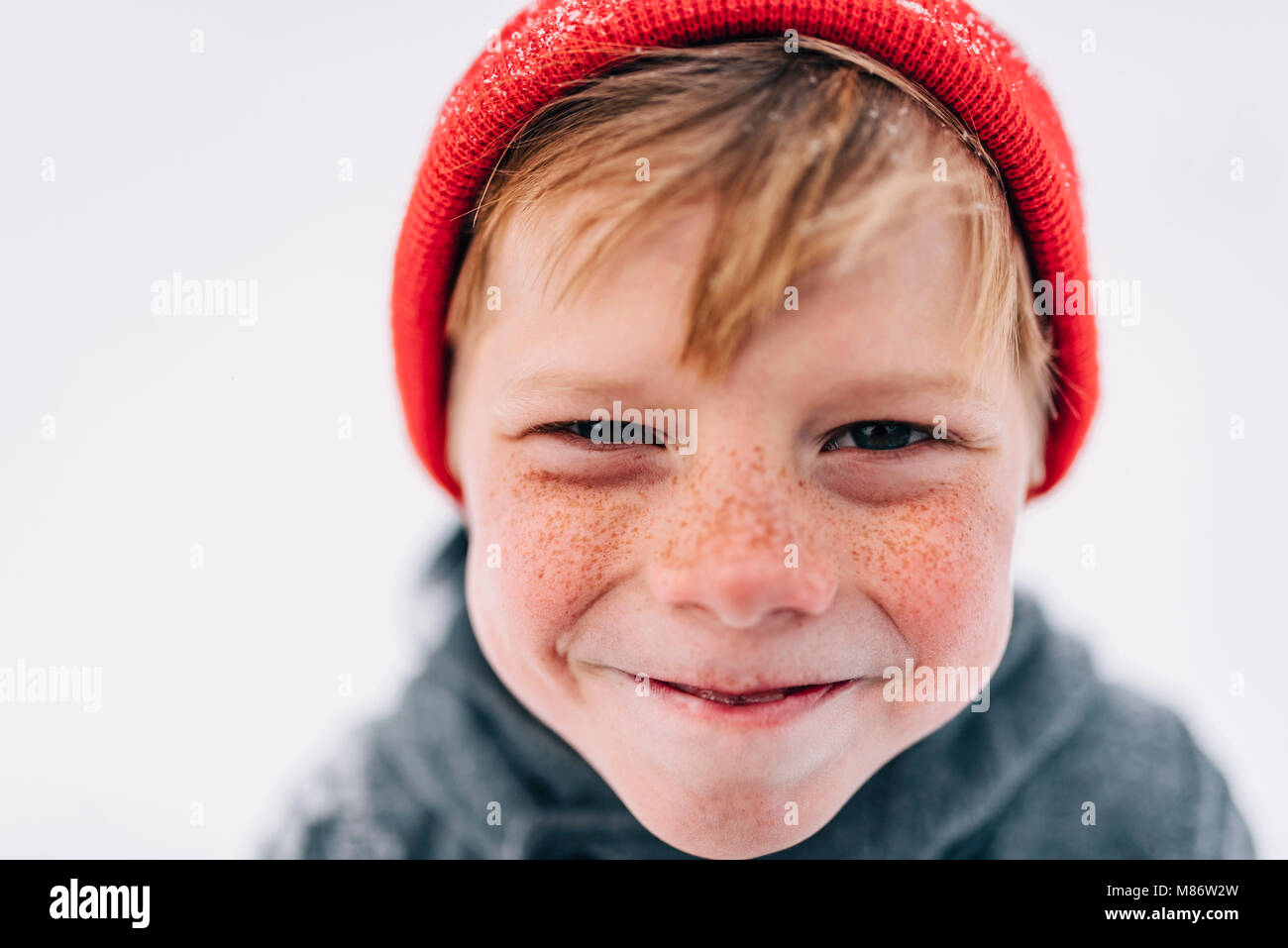 Portrait of a boy with freckles pulling funny faces Stock Photo