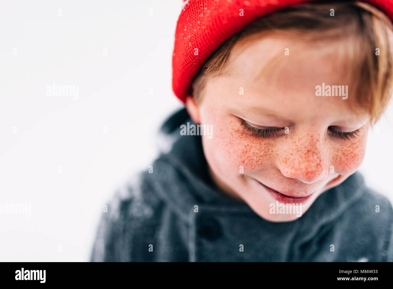 Portrait of a smiling boy with freckles Stock Photo