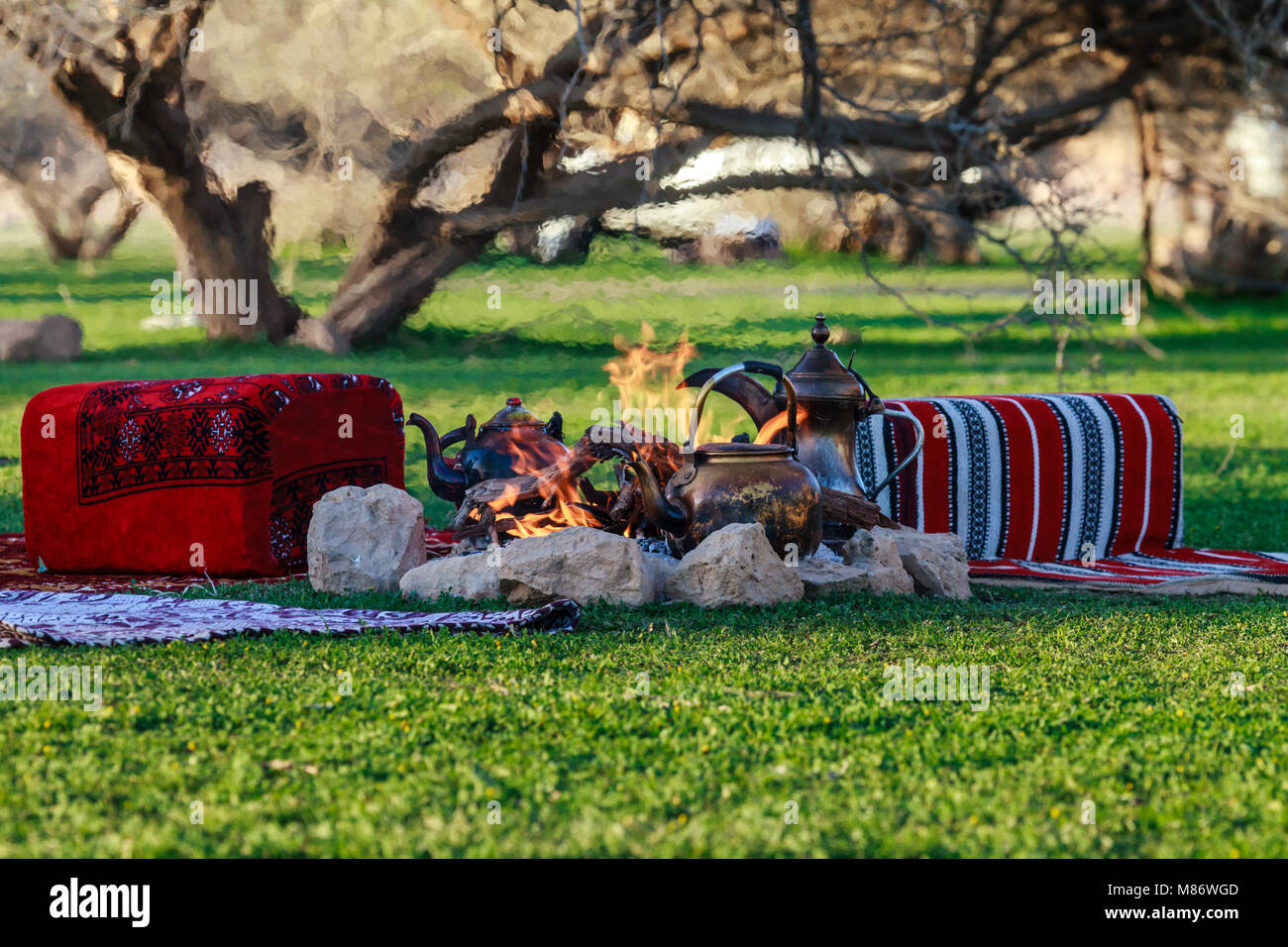 Teapots on a camp fire, Riyadh, Saudi Arabia Stock Photo