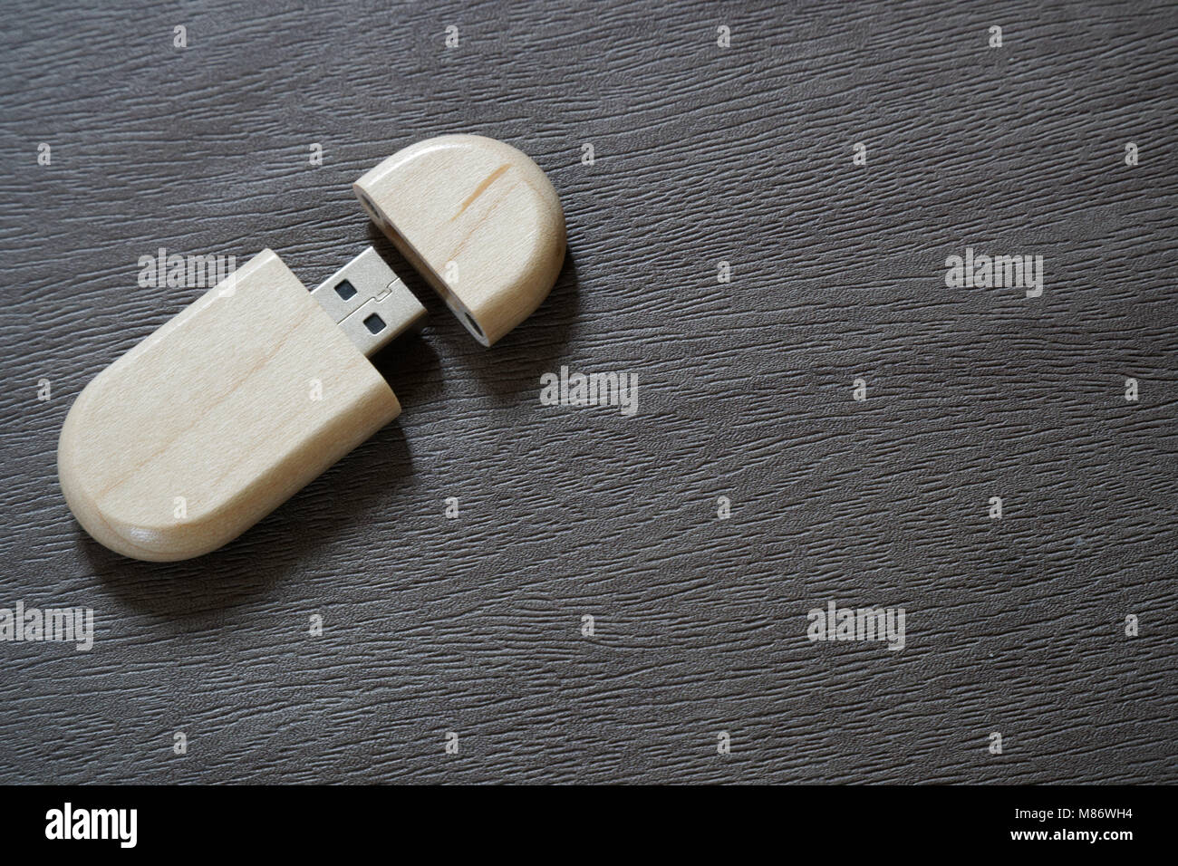 Usb flash drive with wooden surface on desk for USB port plug-in computer  laptop for transfer data and backup business concept Stock Photo - Alamy