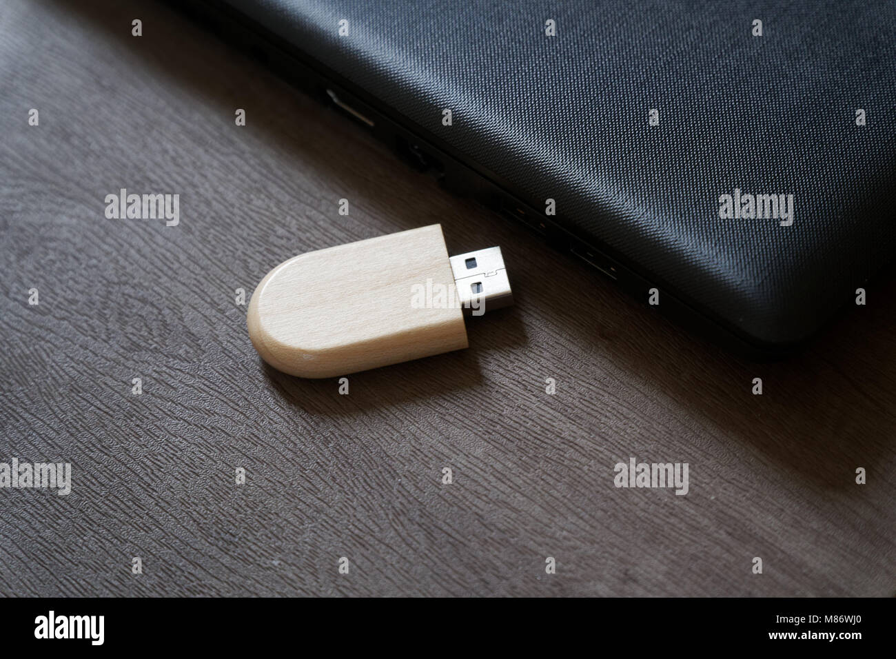 Usb Flash Drive With Wooden Surface On Desk For Usb Port Plug In