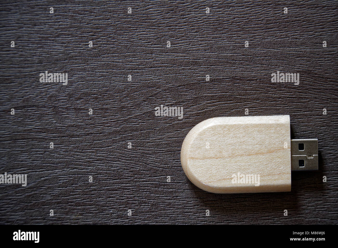 Usb Flash Drive With Wooden Surface On Desk For Usb Port Plug In