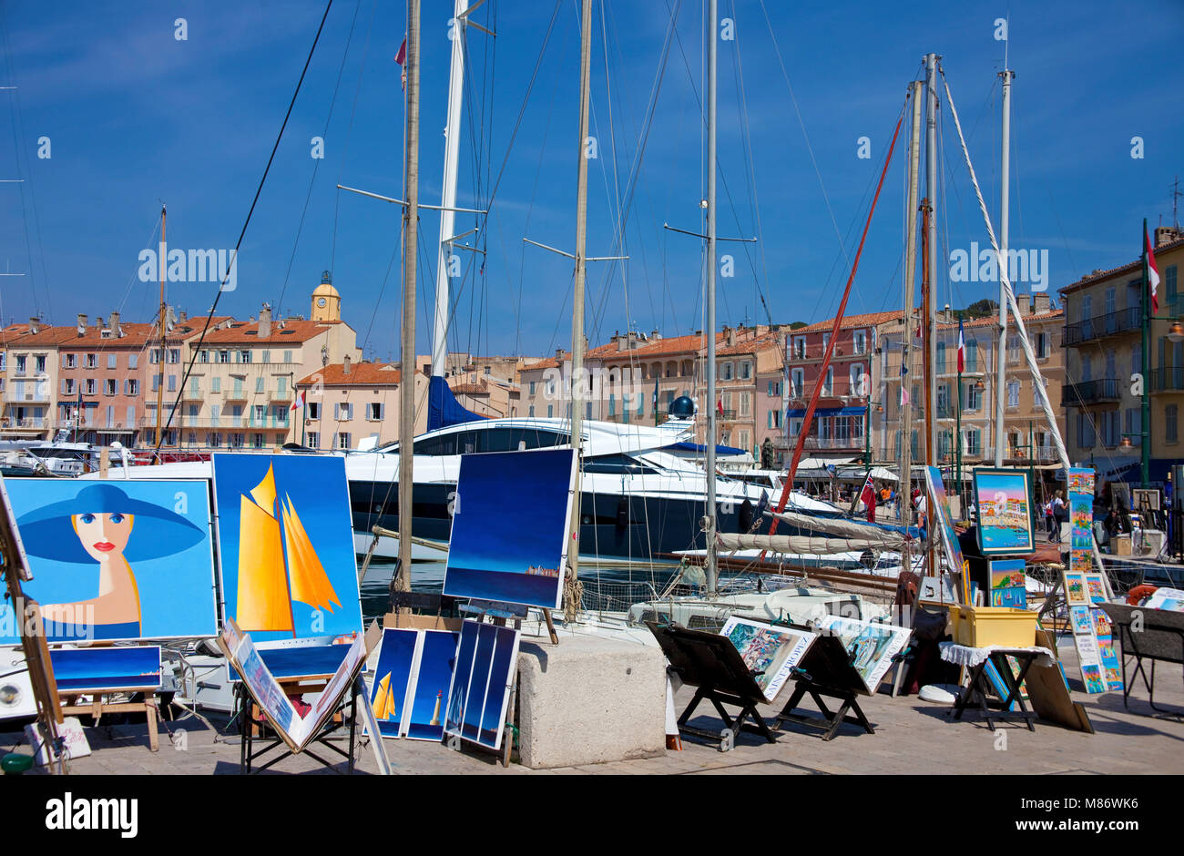 Paintings at strolling promenade at harbour of Saint-Tropez, french riviera, South France, Cote d'Azur, France, Europe Stock Photo
