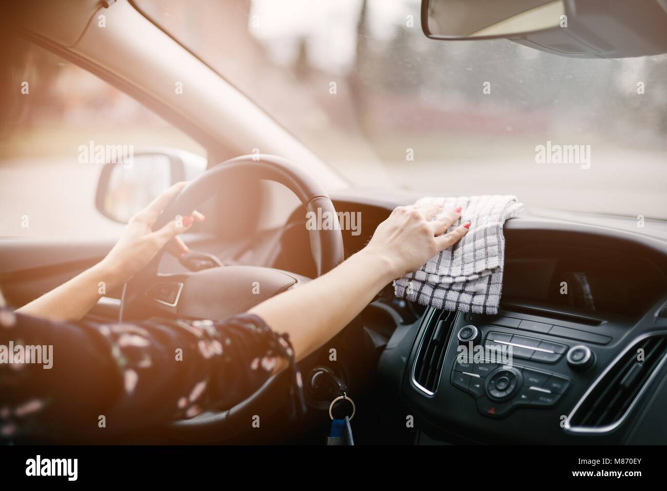 Woman cleaning car dashboard. Modern car interior Stock Photo Alamy