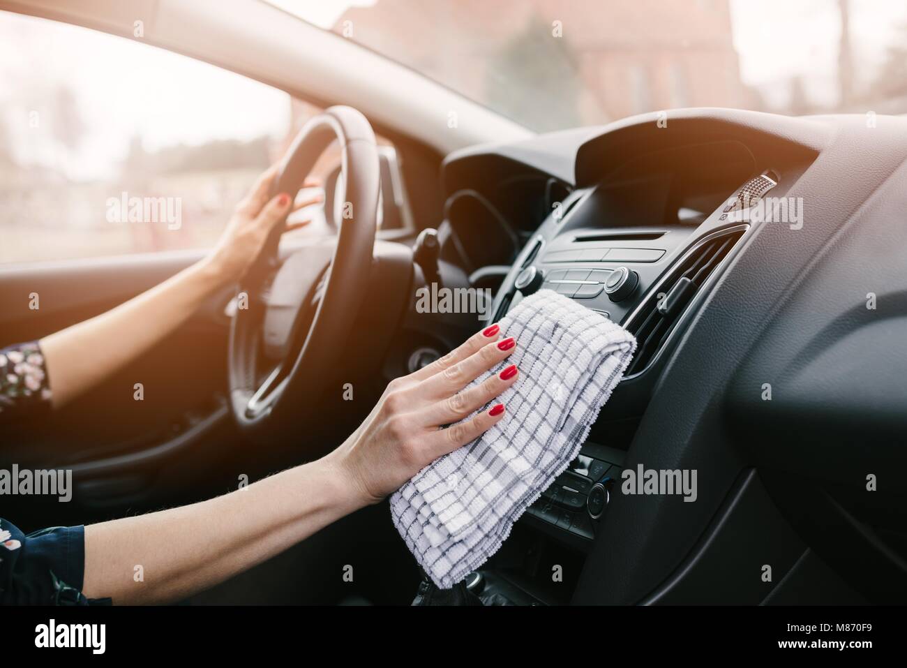 Woman cleaning car dashboard. Modern car interior Stock Photo Alamy