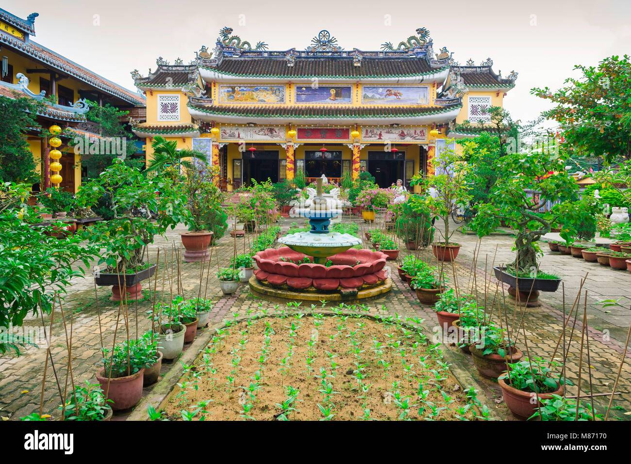 Hoi An Vietnam, view across a courtyard garden towards the Chua Phap
