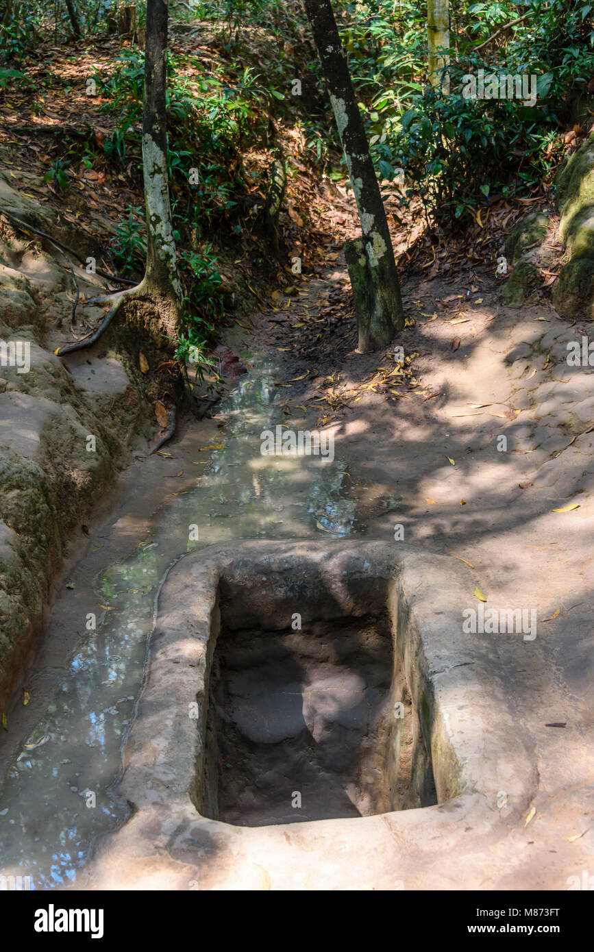 Entrance hole to the Chi Chu tunnels, Vietnam Stock Photo