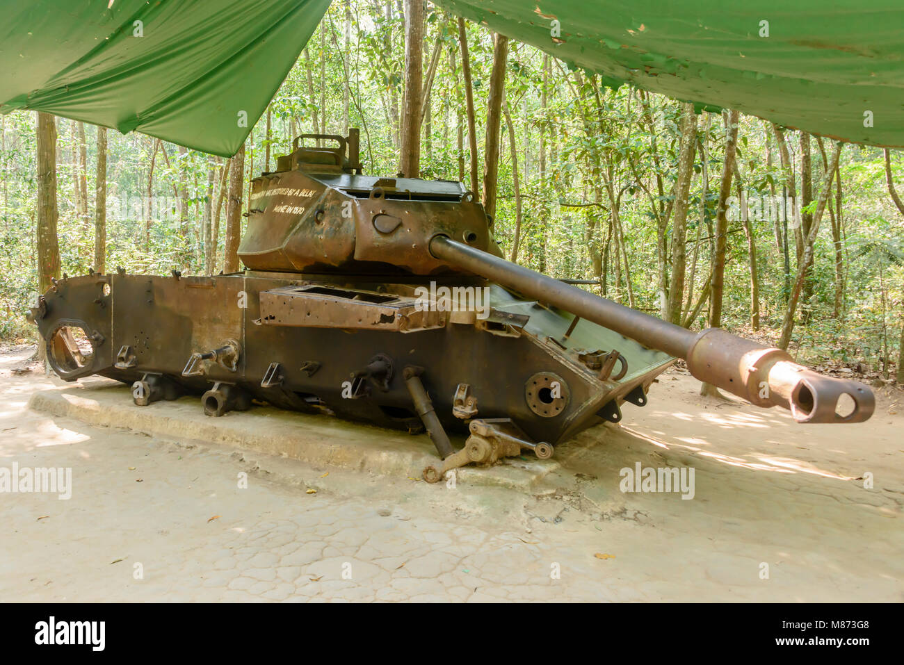 American M41 tank which was destroyed by a Viet Cong delay action mine in 1970.  It has remained in situ ever since.  Cu Chi Tunnels, Vietnam. Stock Photo