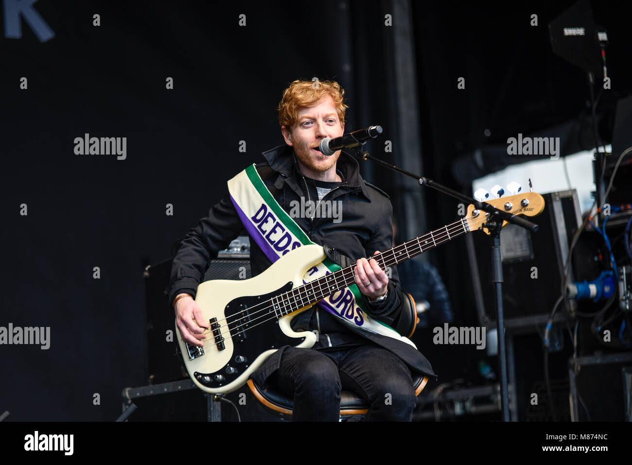 James Johnston bassist of Biffy Clyro performing at the March 4 Women women's equality protest organised by Care International in London Stock Photo