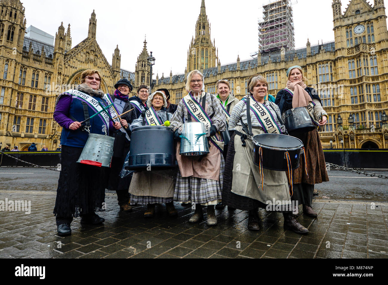 Suffragettes outside the Houses of Parliament during the March 4 Women women's equality protest organised by Care International in London Stock Photo