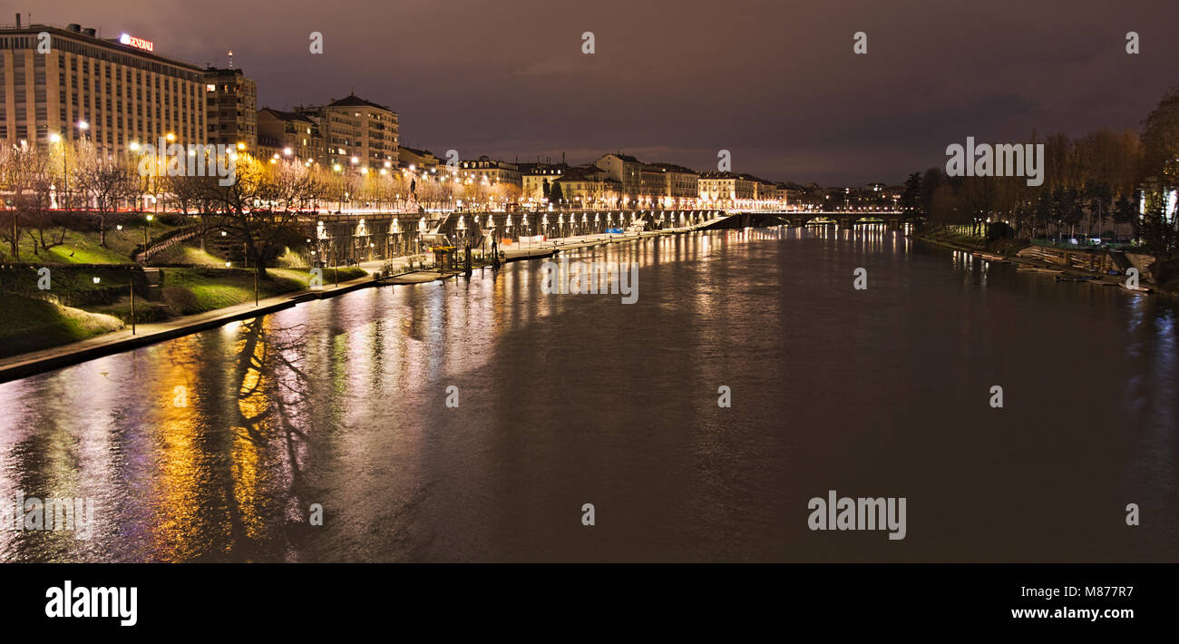 Po river flowing along Torino city near Murazzi docks at night, Italy Stock Photo