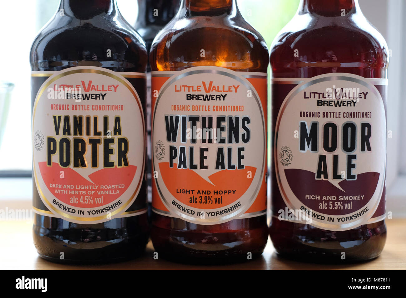 Three different organic beers in glass bottles from Little Valley