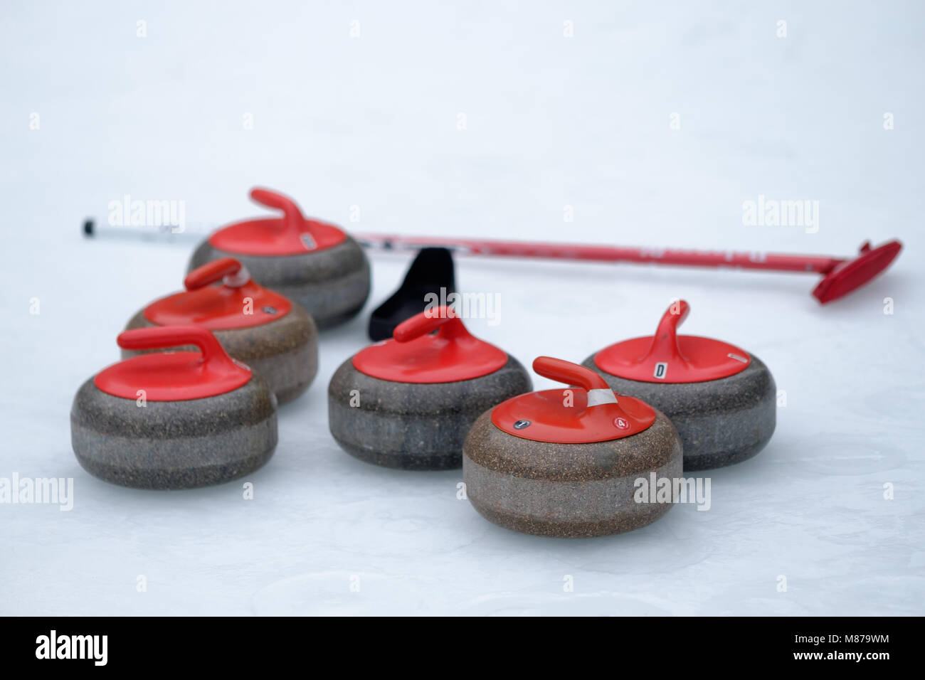 Curling stones on the ice at Bryant Park - New York City Stock Photo
