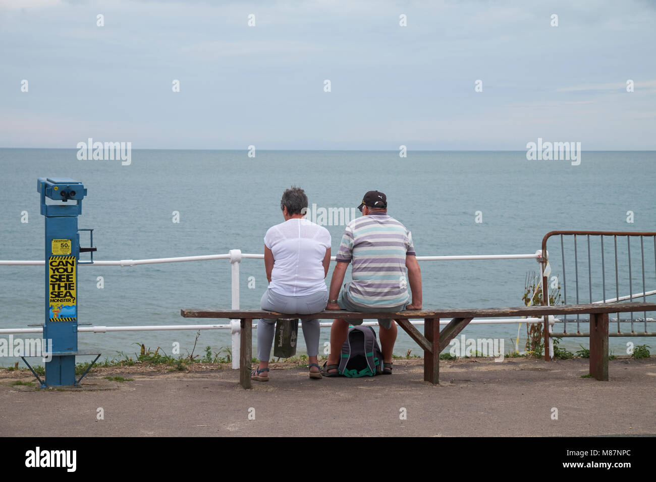 A middle-aged couple looking out to sea at Southwold, Suffolk, England. Stock Photo