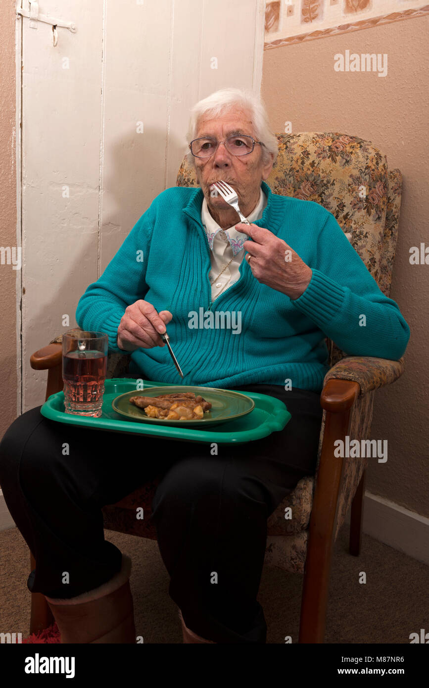 Elderly woman living independently at home eating lunch Stock Photo