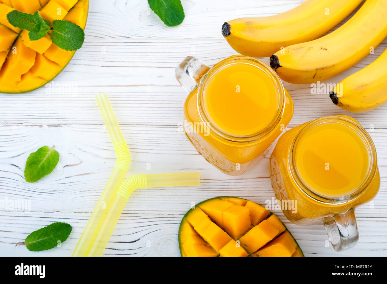 Mango juice. Summer drink with fruits mango and banana cocktail on