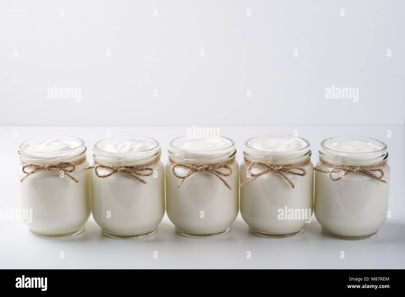 Yogurt in glass jar. Dairy products. Homemade greek yoghurt. Healthy