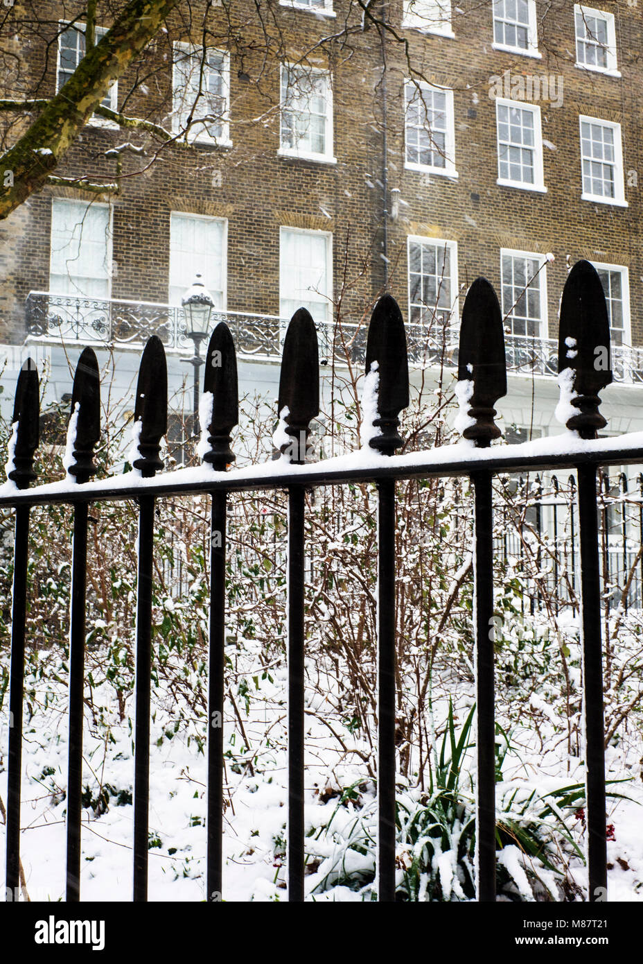 iron park railings covered in snow London Stock Photo Alamy