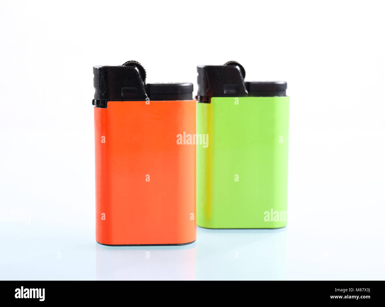 Two cigarette lighters isolated over a white background Stock Photo Alamy