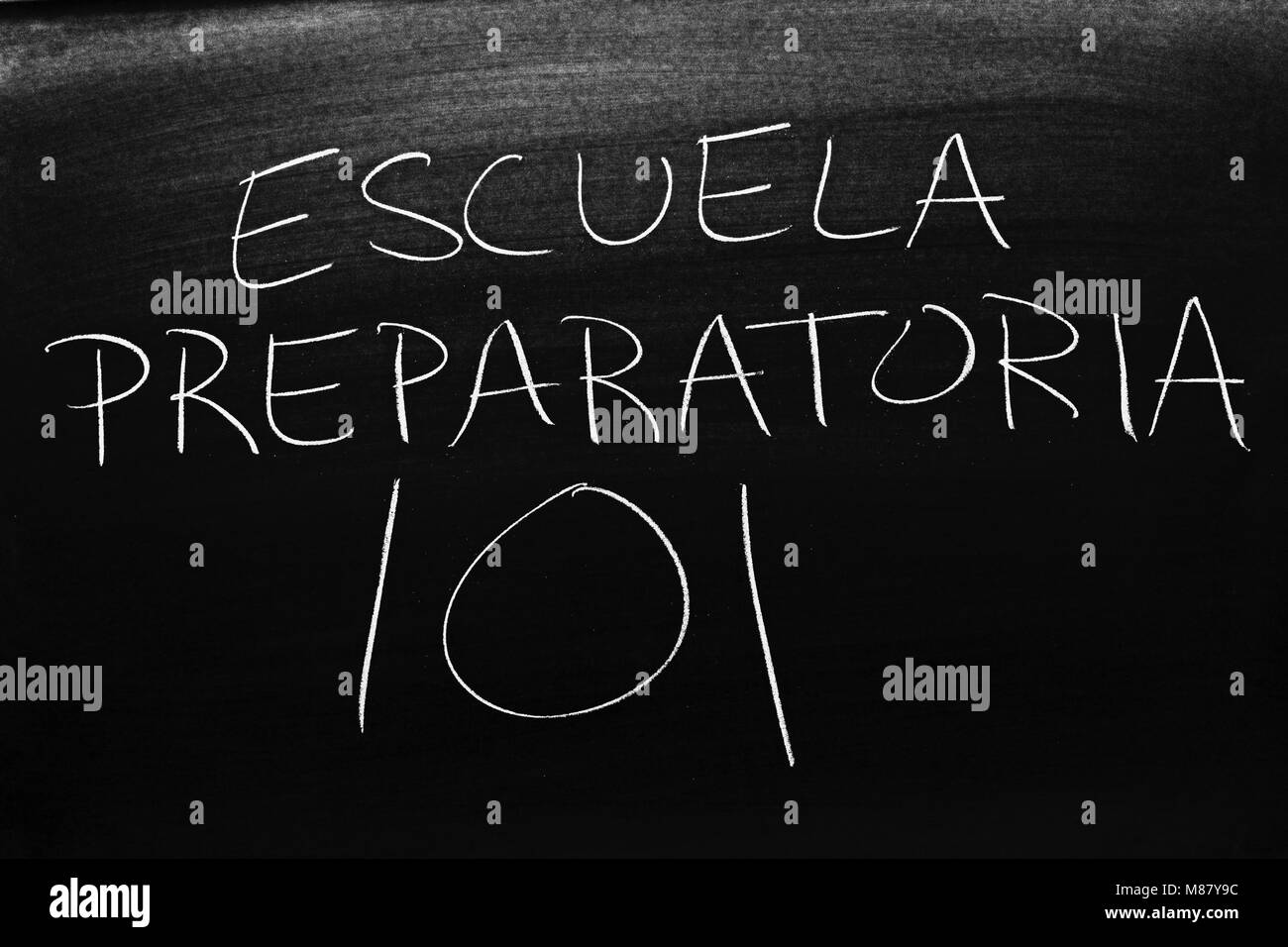 The words Escuela Preparatoria 101 on a blackboard in chalk Stock Photo