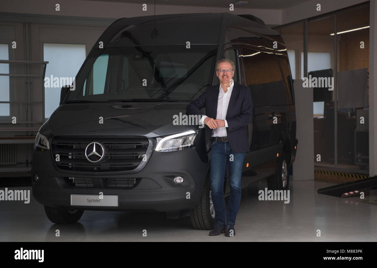 15 March 2018, Germany, Stuttgart: Volker Mornhinweg, head of Mercedes-Benz  Vans of Daimler AG, standing in front of a Mercedes-Benz Sprinter Tourer  319 CDI. Photo: Marijan Murat/dpa Stock Photo - Alamy