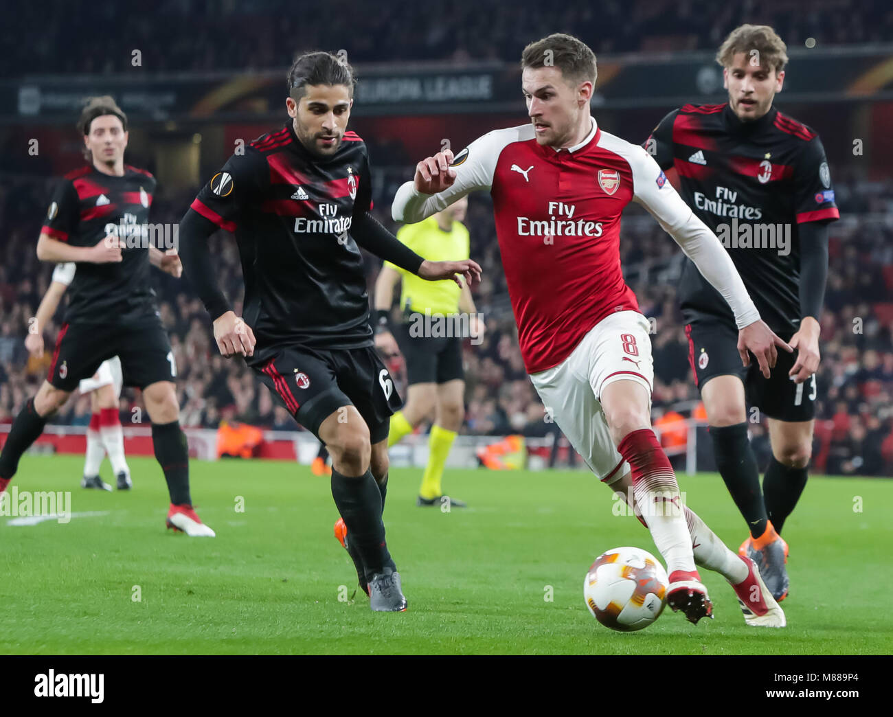 London, UK. 15th Mar, 2018. Aaron Ramsey (C) of Arsenal breaks through during the UEFA Europa League round of 16 second-leg match against AC Milan at the Emirates Stadium in London, Britain on March 15, 2018. Arsenal beat AC Milan 3-1 and advanced to the quarterfinal with a 5-1 aggregate. Credit: Richard Washbrooke/Xinhua/Alamy Live News Stock Photo