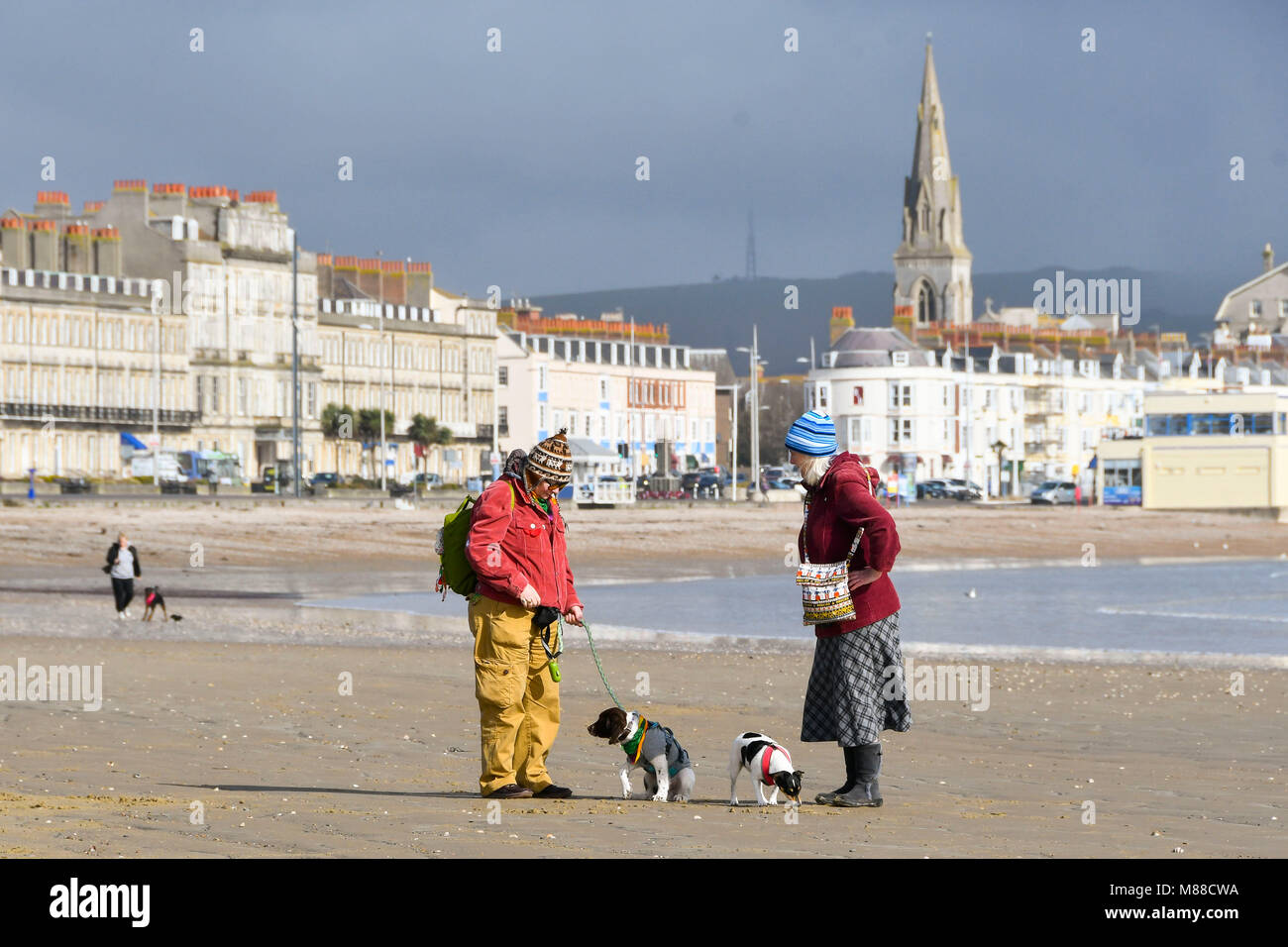Weymouth, Dorset, UK. 16th March 2018. UK Weather. Dog walkers on the
