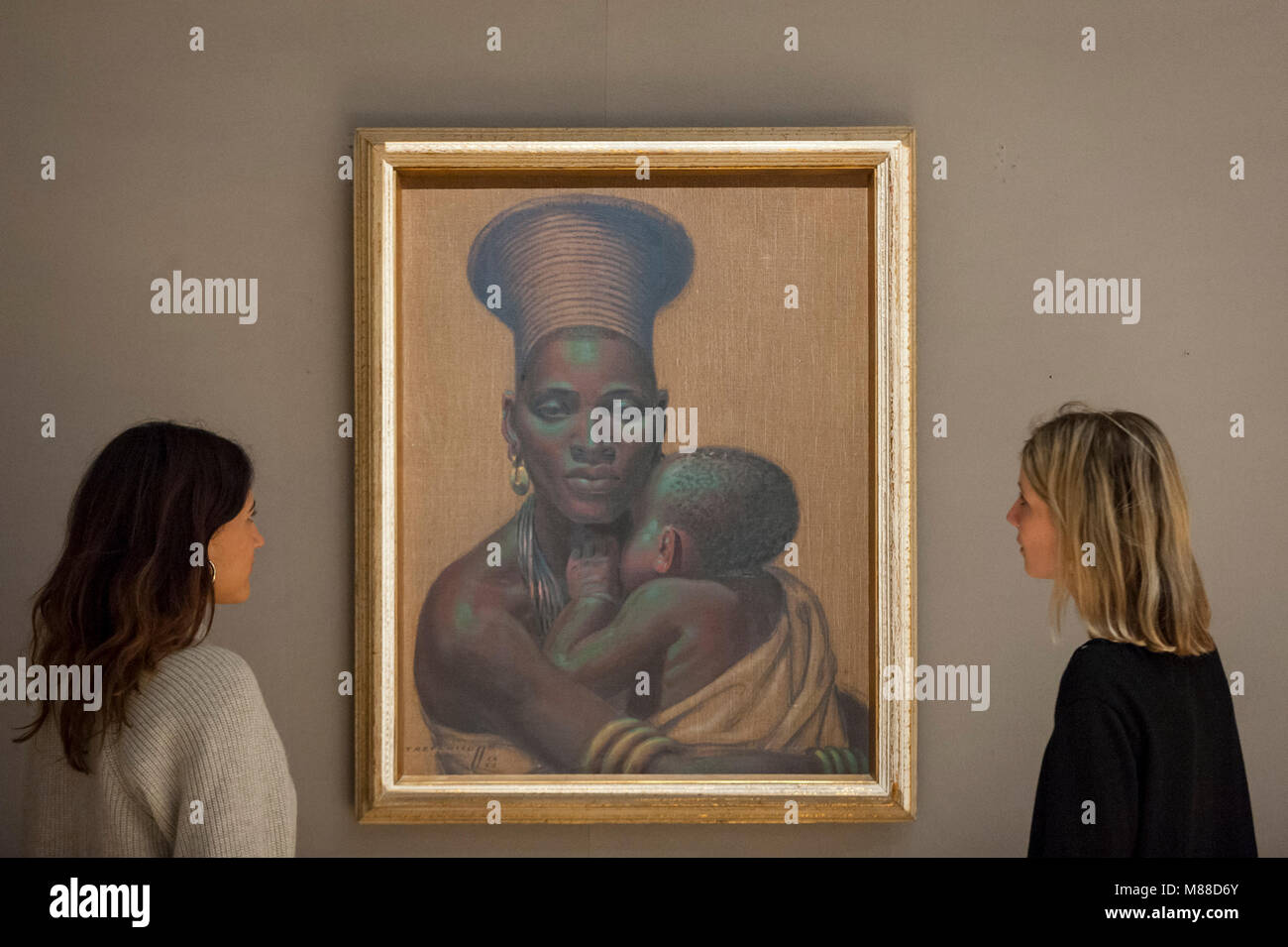 London, UK.  16 March 2018.  Staff members view 'African Madonna', 1952, by Vladimir Griegorovich Tretchikoff (Est. £30,000 - 50,000).  Preview of South African art at Bonhams, New Bond Street which will be sold at auction on 21 March 2018.  The sale features works by renowned South African artists including Irma Stern, Gerard Sekoto and Alexis Preller. Credit: Stephen Chung / Alamy Live News Stock Photo