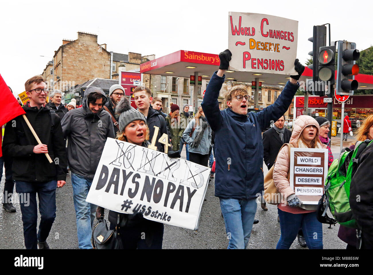 Glasgow, Scotland, UK. 16th March, 2018. Several hundred university lecturers and students from Glasgow University demonstrated in the city centre in support of the official industrial action against the reduction in pension payments being made to university staff and lecturers. This day of action in Glasgow is only one of a number taking place across Britain at other universities and colleges called by the lecturers Trades Union. Credit: Findlay/Alamy Live News Stock Photo