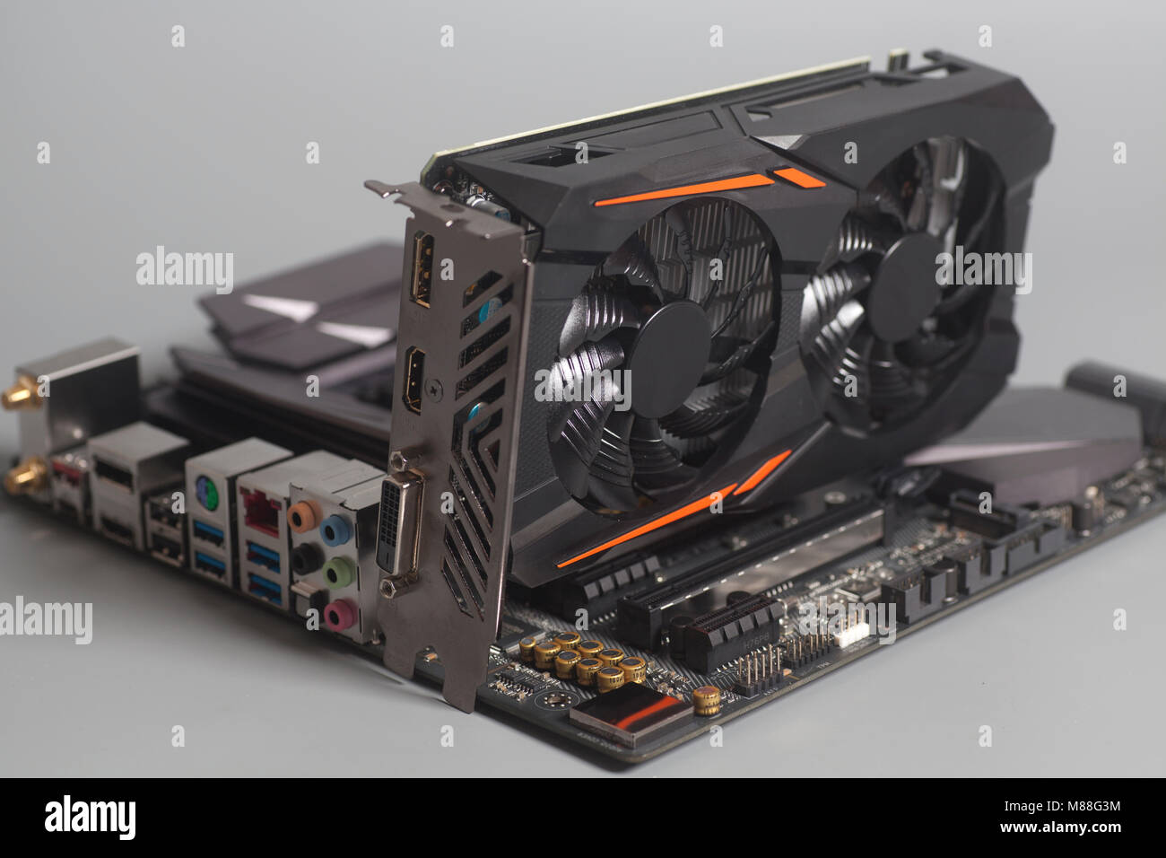 Motherboard with Graphic videocard on gray background Stock Photo - Alamy