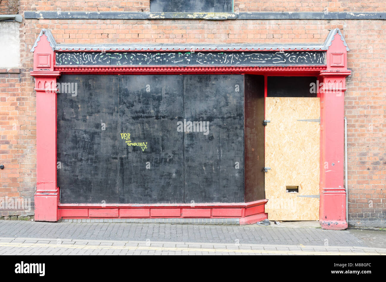 Boardedup shop front in the industrial town of Walsall in the West