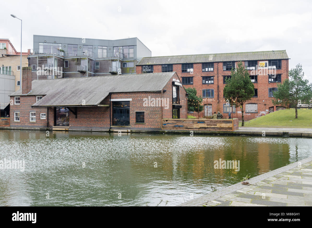 Old industrial warehouses in Gallery Square overlooking the Walsall Canal Basin in the industrial town of Walsall in the West Midlands Stock Photo