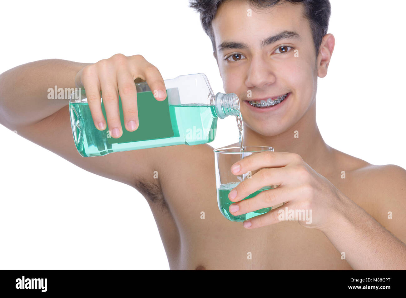 Cute teenager with white background, wearing braces on his teeth. Use