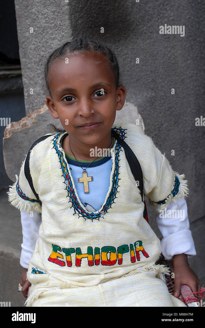 Ethiopia, Addis Ababa, girl with cross and cotton dress / Maedchen mit tradtioneller Kleidung Stock Photo