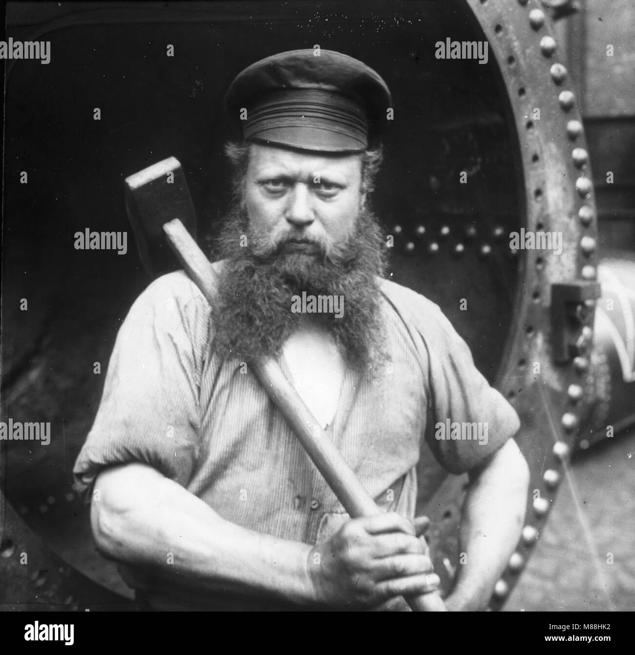 Shipyard Worker, Germany, by Burton Holmes, 1907 Stock Photo
