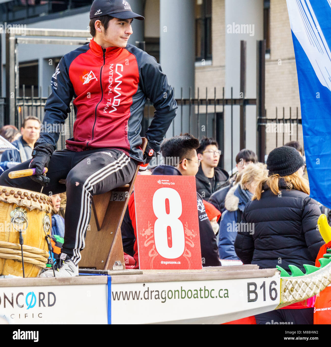 VANCOUVER, CANADA - February 18, 2018: Man in dragon boat at Chinese New Year parade in Vancouver Chinatown. Stock Photo