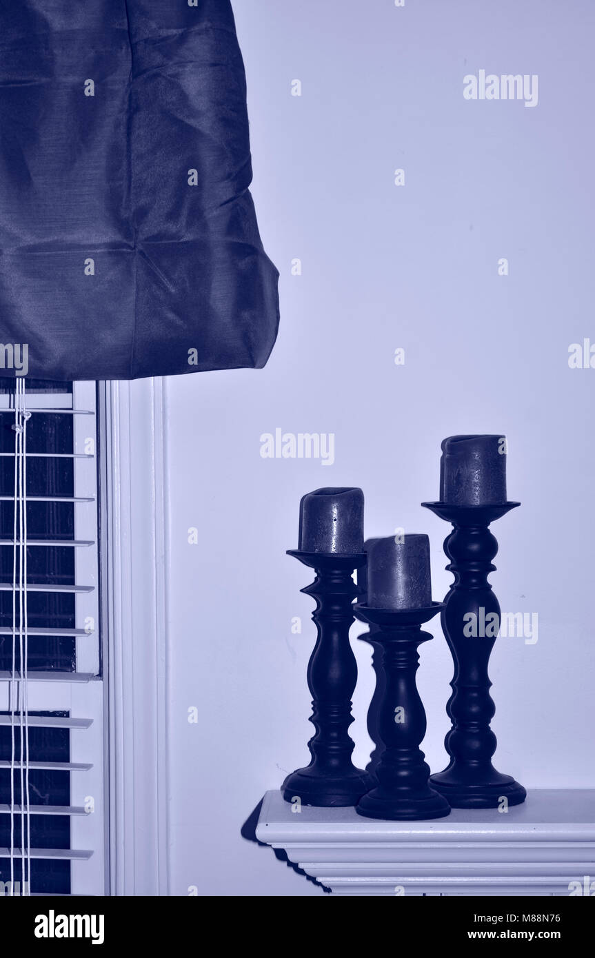 Three candle holders near window Stock Photo Alamy