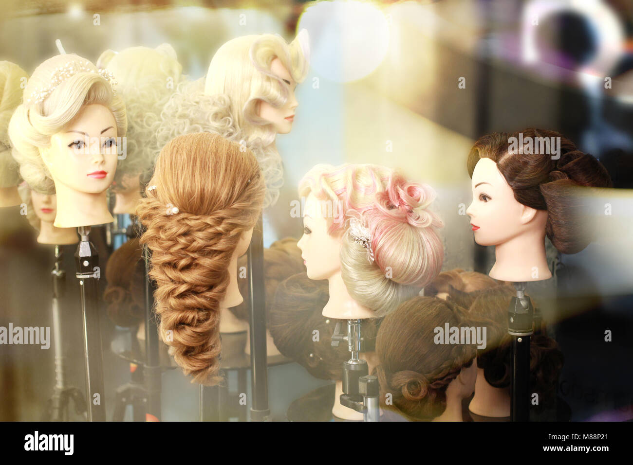 variety of hair styles on the head mannequin in salon Stock Photo Alamy