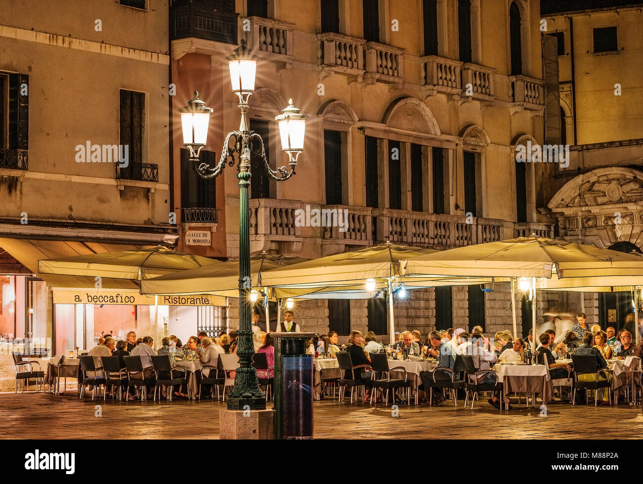 Patrons at an outdoor cafe restaurant, Venice, Italy Stock Photo