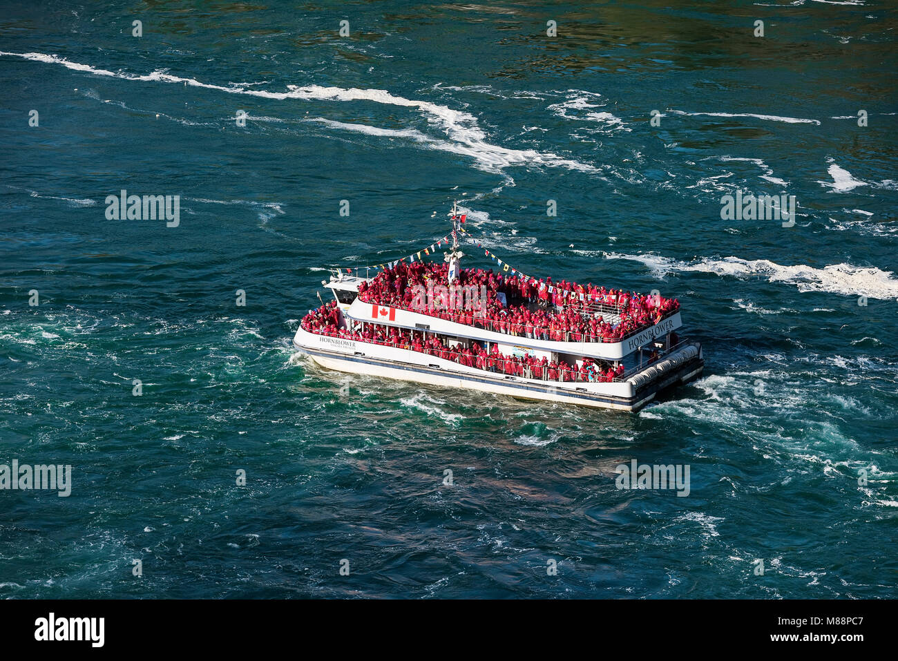 Sightseeing boat approaches Horseshoe Falls, Niagra Falls, Ontario, Canada Stock Photo