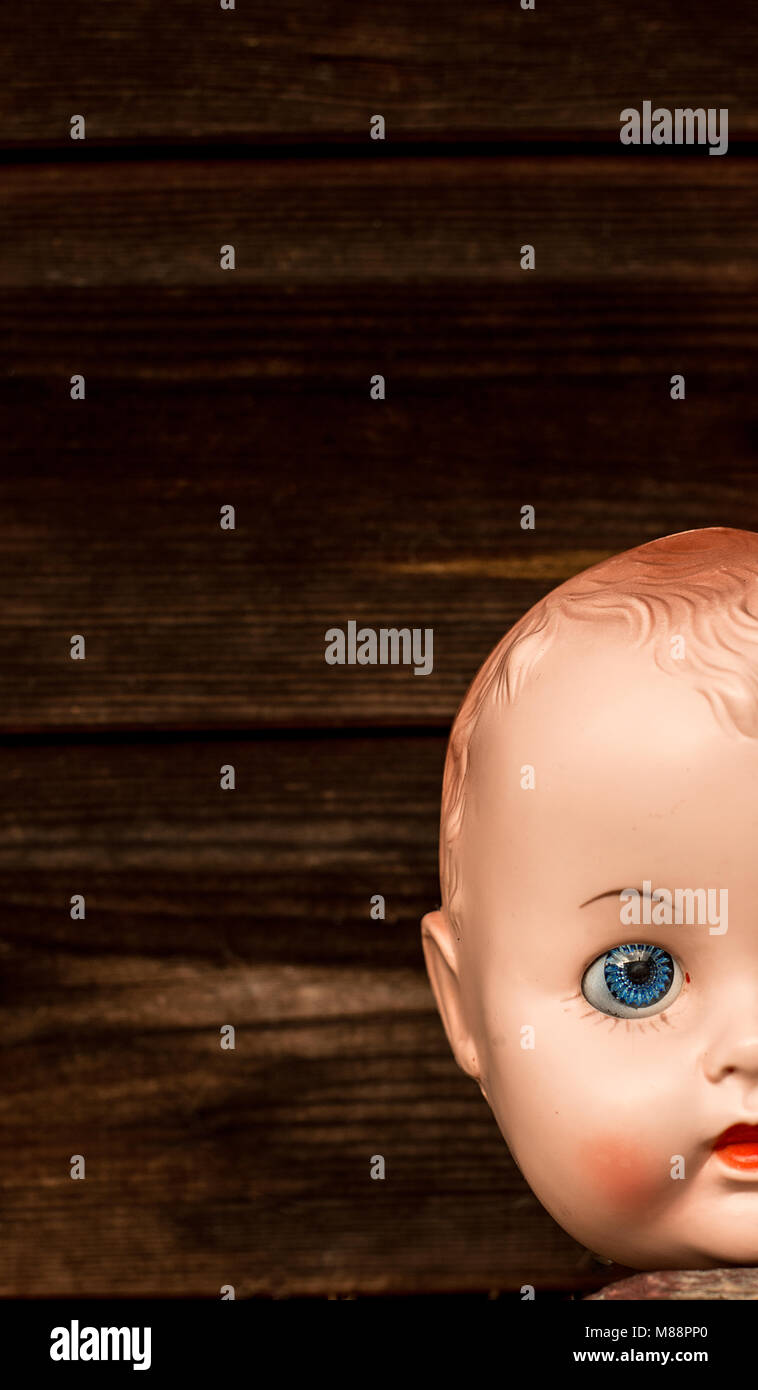 wooden doll heads with faces