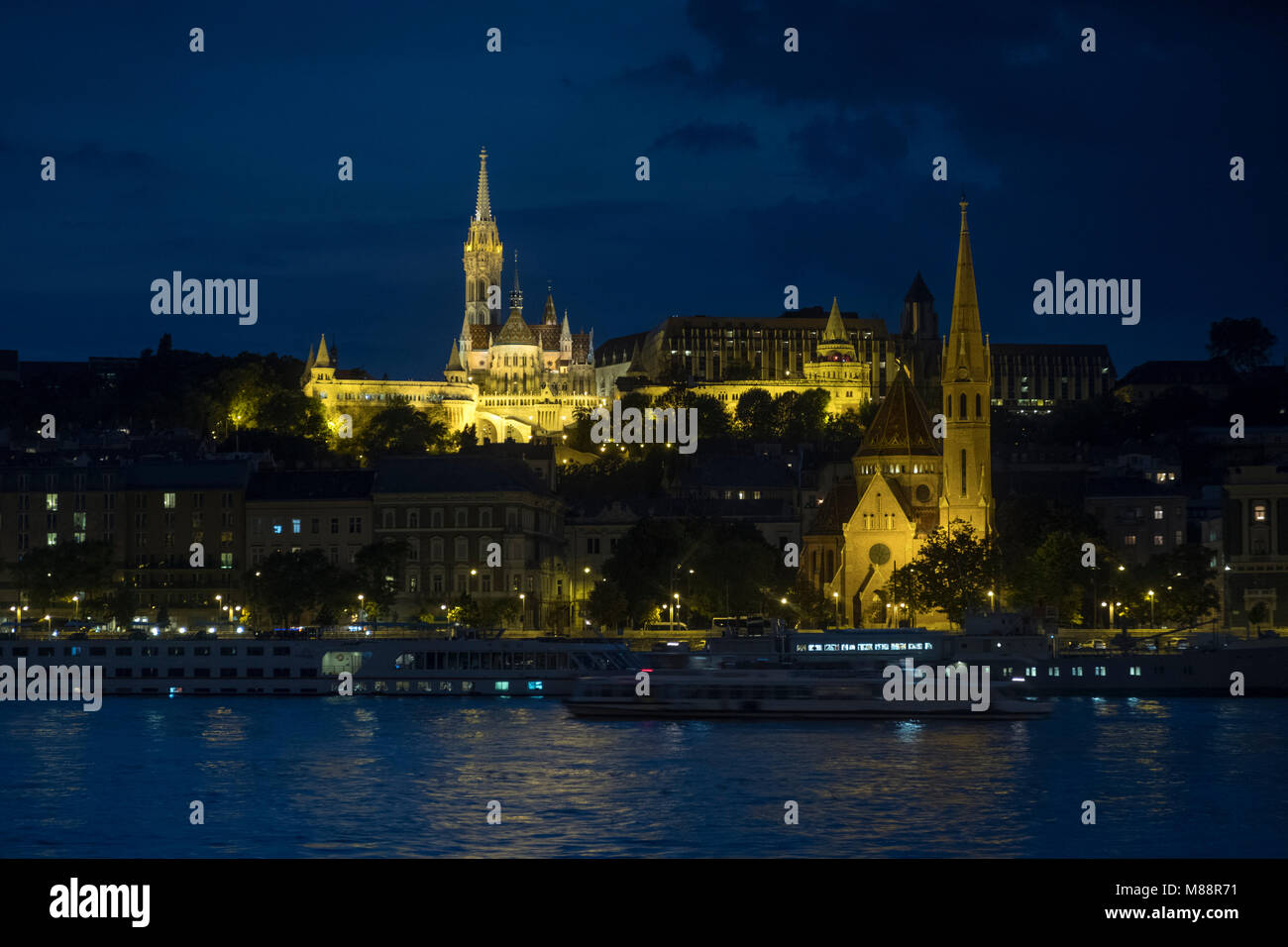 Matthias Church and River Danube lit up in the twilight of a September evening Stock Photo