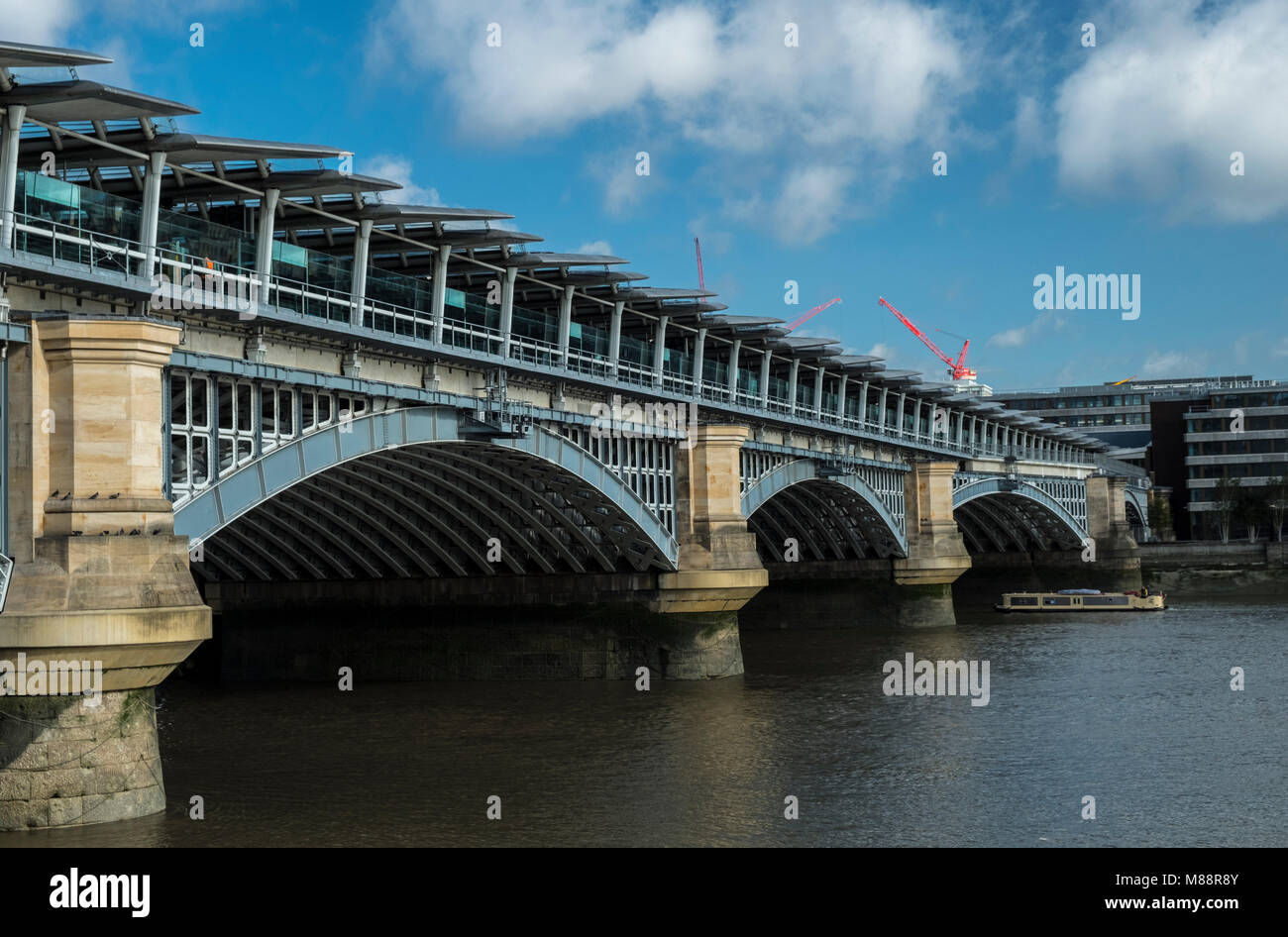 Blackfriars Station and Bridge seen from the south side of the River Thames in London on a summer morning. Stock Photo