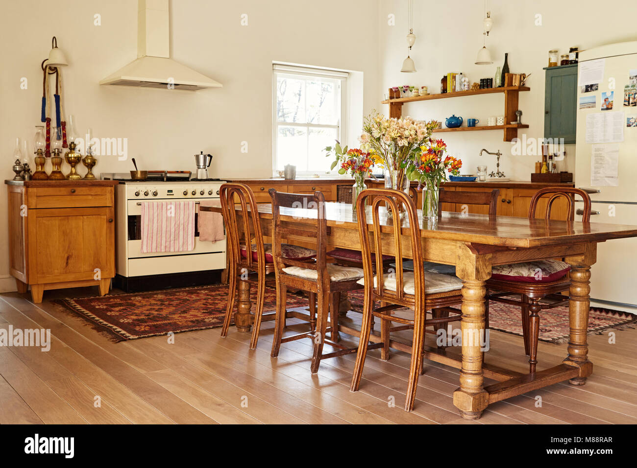 Interior of the country style kitchen and dining table in a large residential home Stock Photo