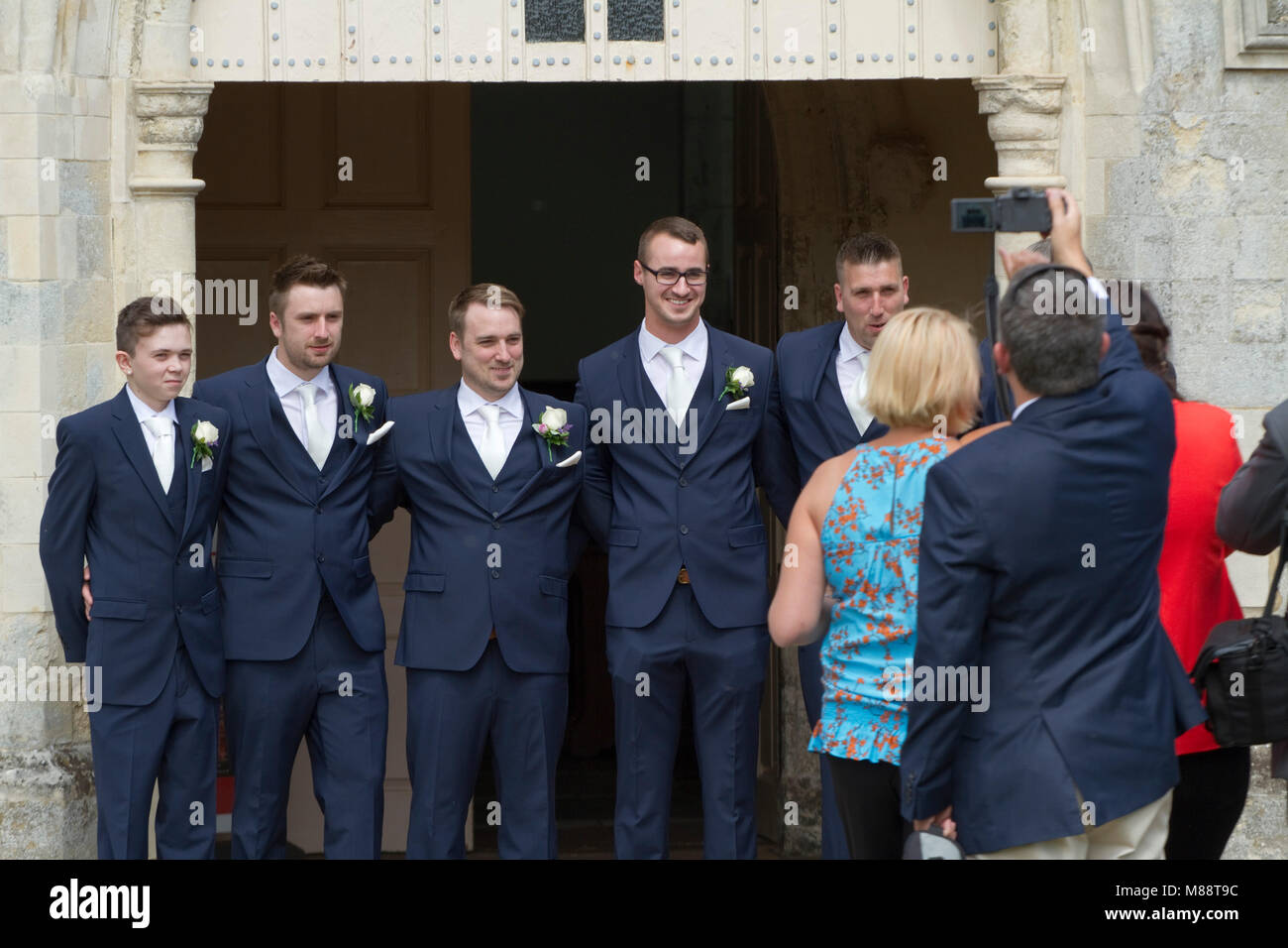 The groom's party wearing matching blue suits Stock Photo