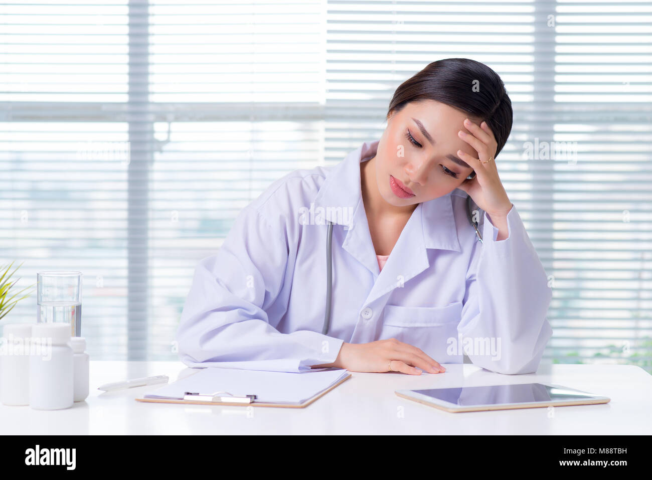 Stressed asian female doctor hi-res stock photography and images - Alamy