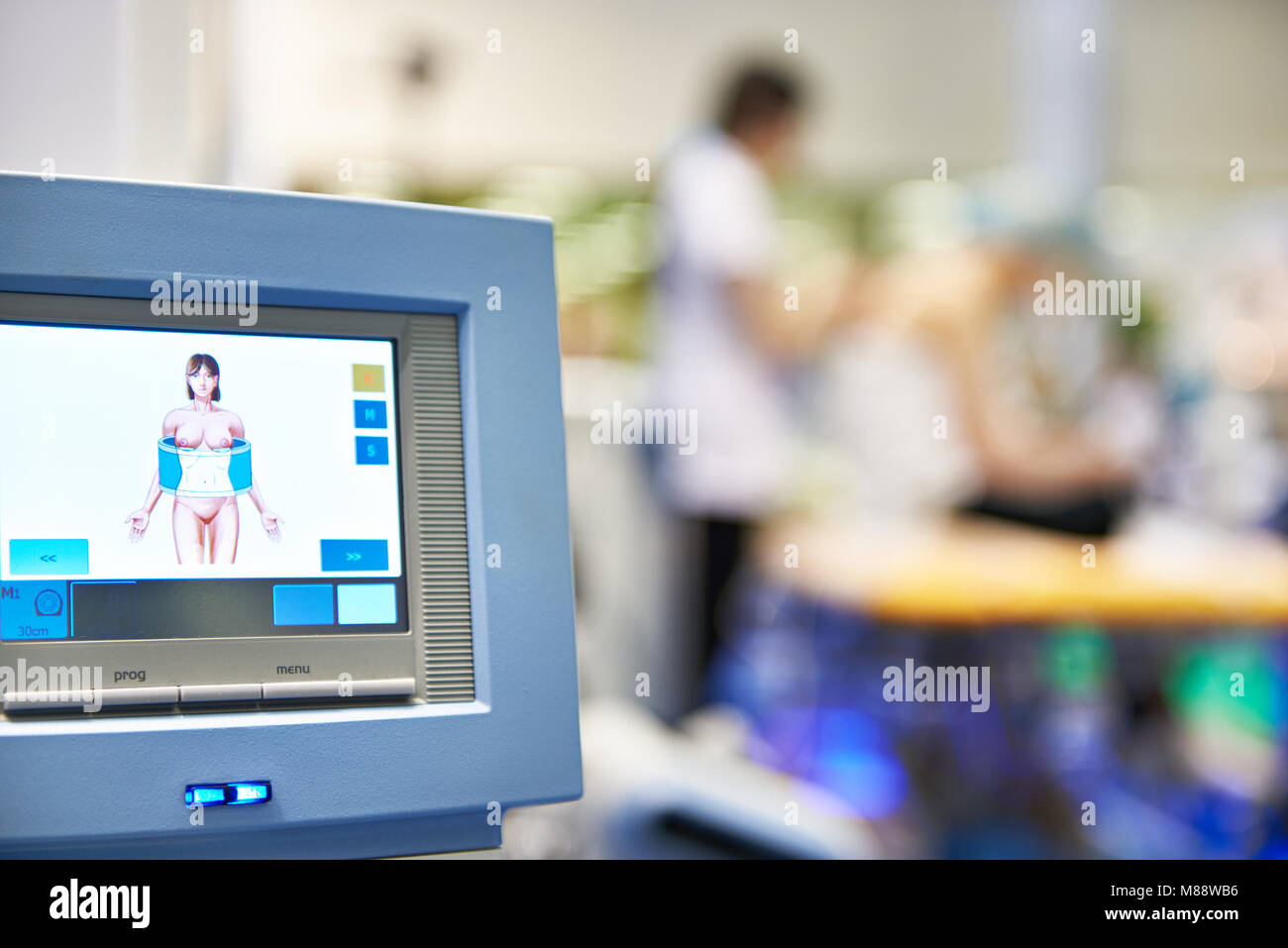 Monitor medical equipment for laser and shock wave therapy in clinic Stock Photo