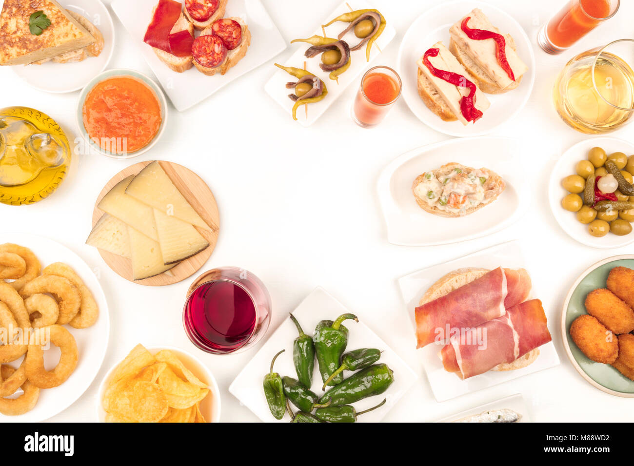 An overhead photo of a collection of Spanish tapas food, shot from