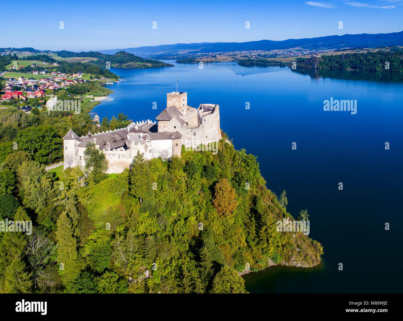 Poland. Medieval Castle in Niedzica, built in 14th century, artificial Czorsztyn Lake and far view of the ruins of Czorsztyn castle, Aerial view Stock Photo